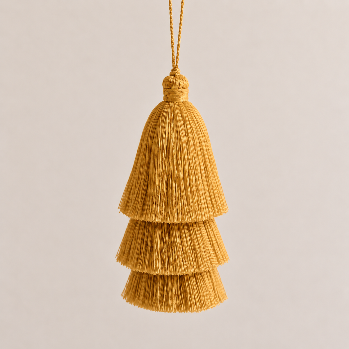 GOLD TRIPLE TASSEL TOTEM